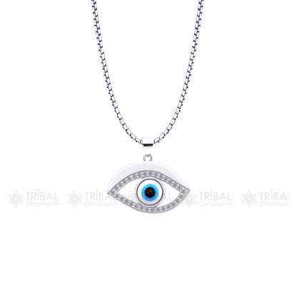 Sterling silver evil eyes pendant with CZ stone from TRIBAL ORNAMENTS, featuring intricate tribal design and sparkling gemstone accents.