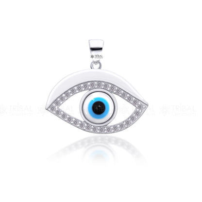 Sterling silver evil eyes pendant with CZ stone from TRIBAL ORNAMENTS, featuring intricate tribal design and sparkling gemstone accents.