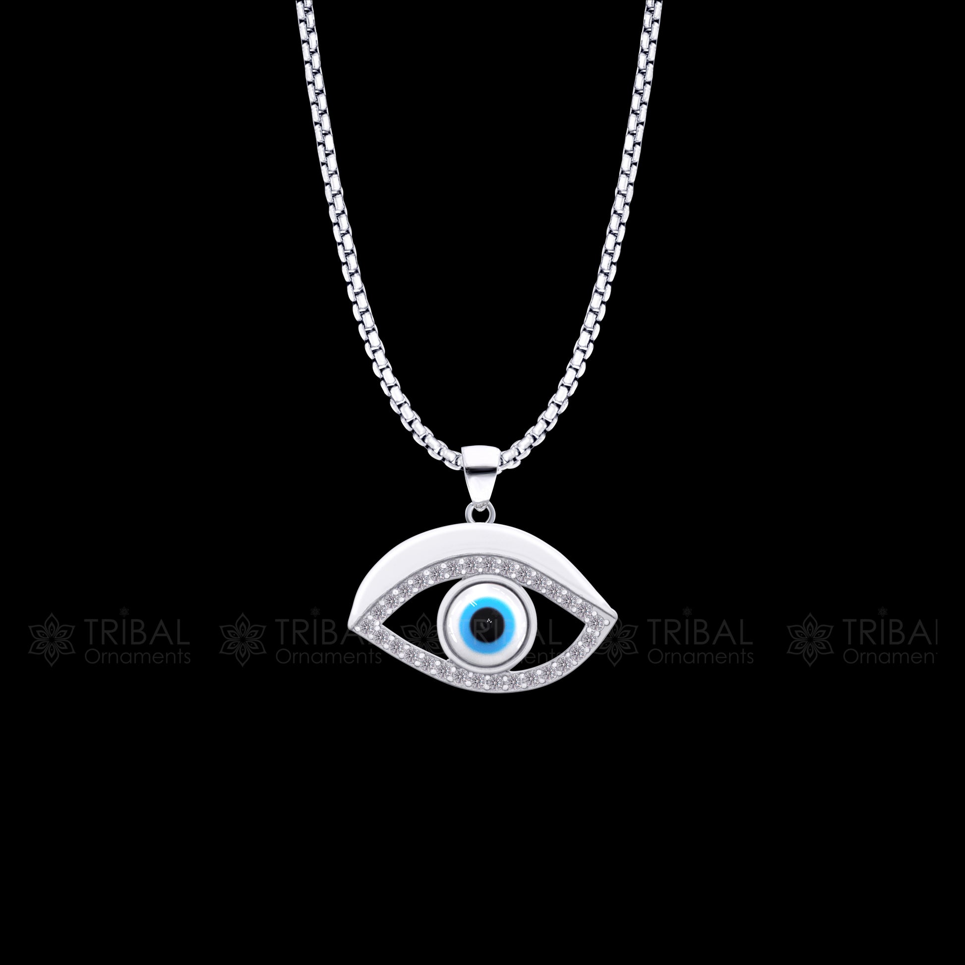 Pure 925 sterling silver evil eyes pendant with CZ stone from TRIBAL ORNAMENTS, featuring intricate tribal design and sparkling gemstone.
