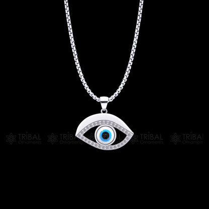 Pure 925 sterling silver evil eyes pendant with CZ stone from TRIBAL ORNAMENTS, featuring intricate tribal design and sparkling gemstone.