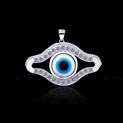 Pure 925 sterling silver evil eyes pendant with CZ stone from TRIBAL ORNAMENTS, showcasing detailed evil eye design and sparkling stones.