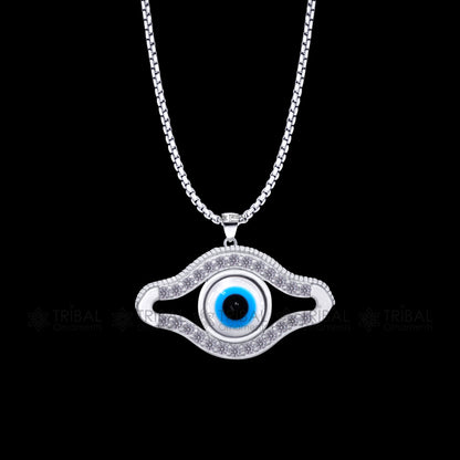 Sterling silver evil eyes pendant with CZ stone from TRIBAL ORNAMENTS, featuring a detailed tribal design and protective charm.