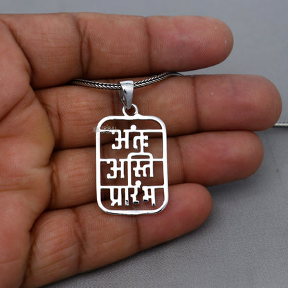Polished 925 sterling silver Antah Asti Prarambh pendant by Tribal Ornaments, featuring intricate tribal design and handcrafted details.