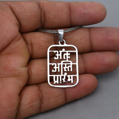 Polished 925 sterling silver Antah Asti Prarambh pendant by Tribal Ornaments, featuring intricate tribal handmand design.
