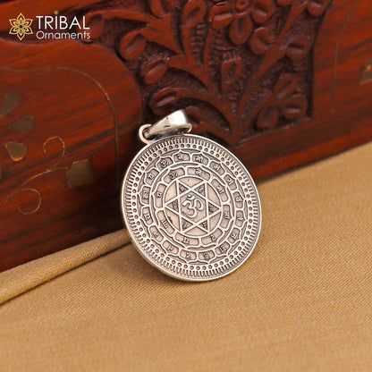 Small 925 silver Divine Sudarshan Chakra Yantram pendant by TRIBAL ORNAMENTS, featuring intricate spiritual design and energetic Kavacham symbol.