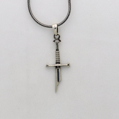 Sterling silver small sword pendant by Tribal Ornaments, handmade unisex jewelry with a white finish and intricate design.