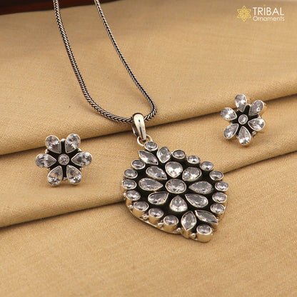 Sterling silver floral charm necklace set with CZ cut stones, featuring a pendant on an 18-inch chain, stylish jewelry by TRIBAL ORNAMENTS.