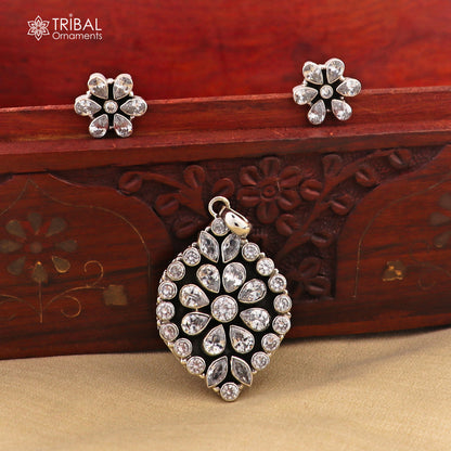 Sterling silver floral charm necklace set with CZ cut stones, featuring a pendant on an 18-inch chain, stylish jewelry from TRIBAL ORNAMENTS.