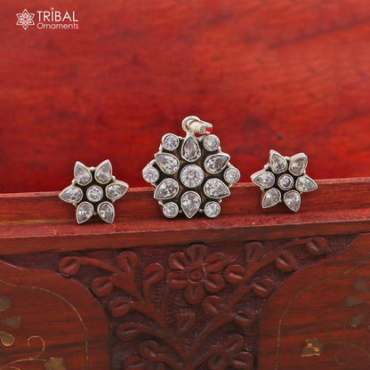Sterling silver CZ cut stone floral charm necklace set by TRIBAL ORNAMENTS with 18-inch chain and stylish jewelry design.