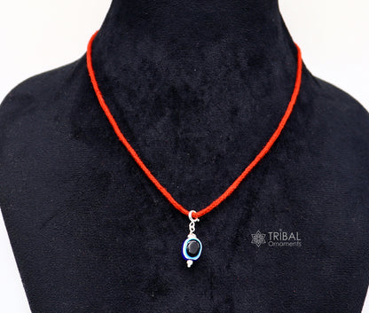 Sterling silver Evil Eye pendant from TRIBAL ORNAMENTS, featuring a modern trendy design to protect against negativity.