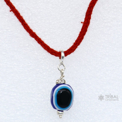 925 sterling silver Evil Eye pendant by TRIBAL ORNAMENTS featuring a modern trendy design to protect from negativity