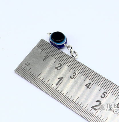 Sterling silver Evil Eye pendant by TRIBAL ORNAMENTS, modern trendy jewelry to protect from negativity.