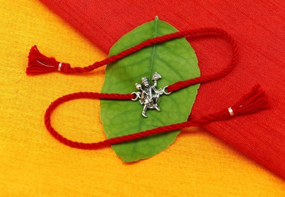 925 sterling silver Flying Hanuman idol bracelet with red thread rakhi, traditional Hindu jewelry by Tribal Ornaments.
