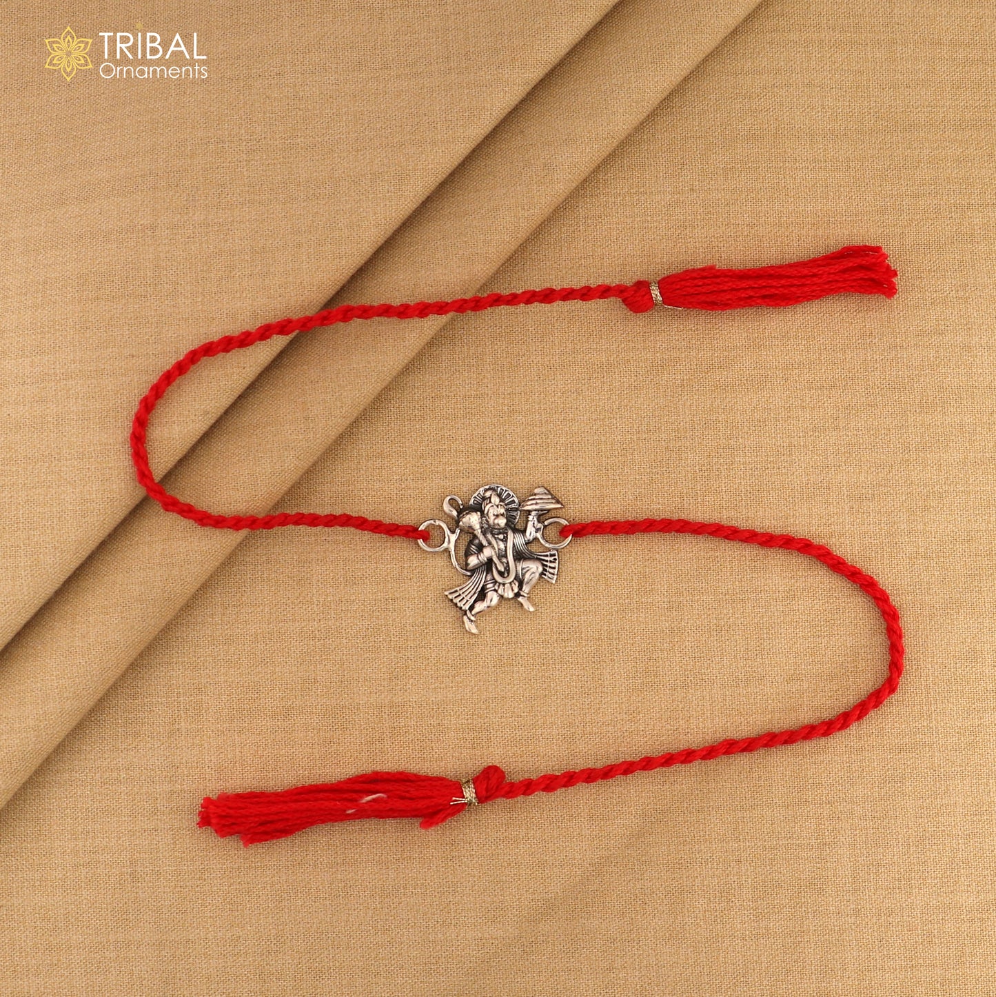 Sterling silver Flying Hanuman idol Rakhi with red thread, traditional Indian bracelet by Tribal Ornaments.