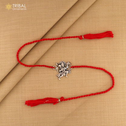 Sterling silver Flying Hanuman idol Rakhi with red thread, traditional Indian bracelet by Tribal Ornaments.