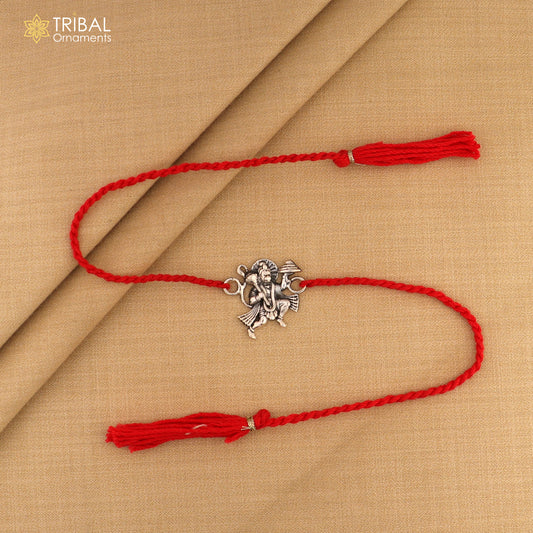 Sterling silver Flying Hanuman idol Rakhi with red thread, traditional Indian bracelet by Tribal Ornaments.