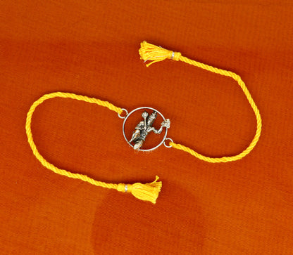 925 sterling silver Hanuman idol bracelet with red thread rakhi, tribal ornaments design, featuring intricate craftsmanship and vibrant red thread.