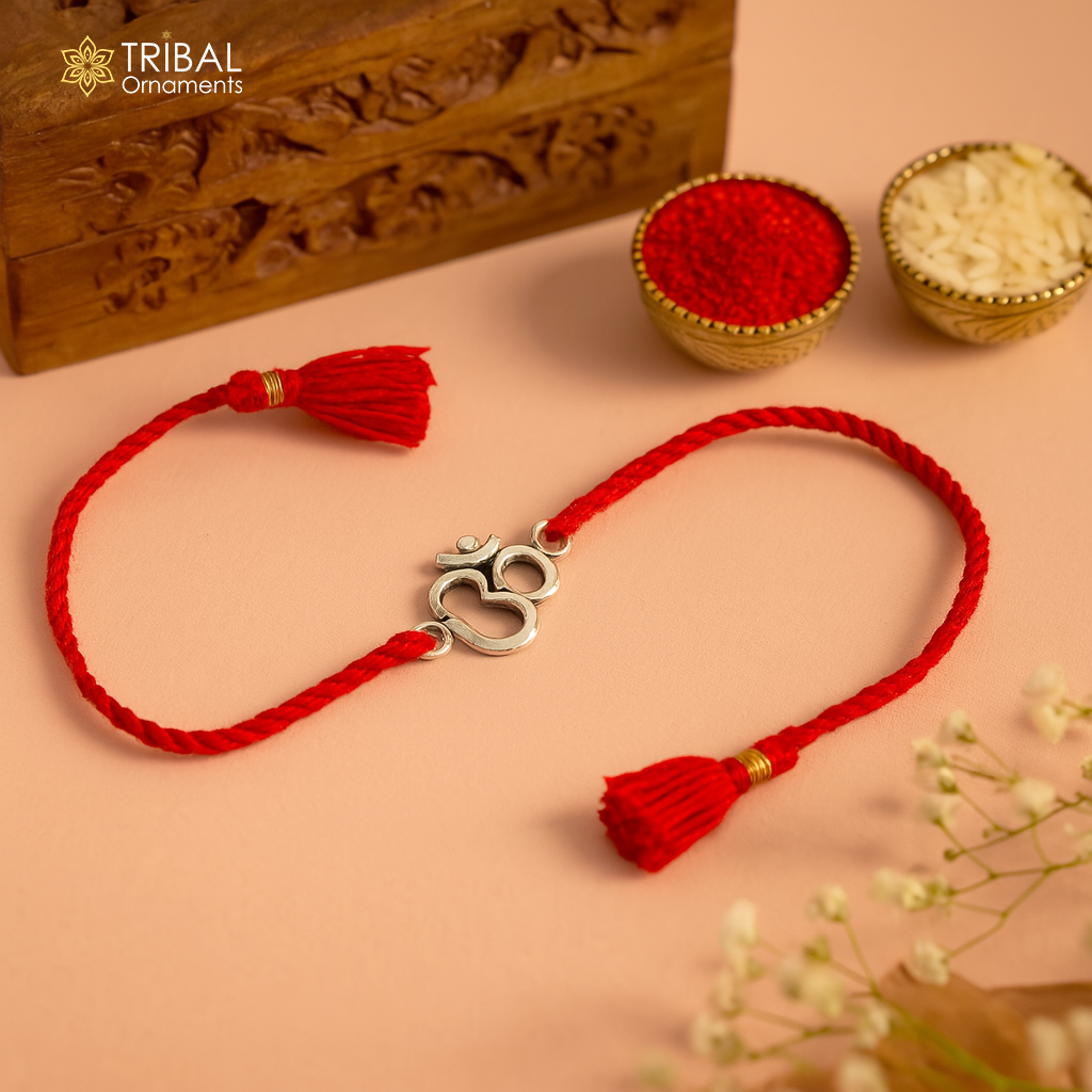 925 sterling silver OM design bracelet with yellow thread Rakhi, featuring custom tribal ornament craftsmanship and intricate detailing.