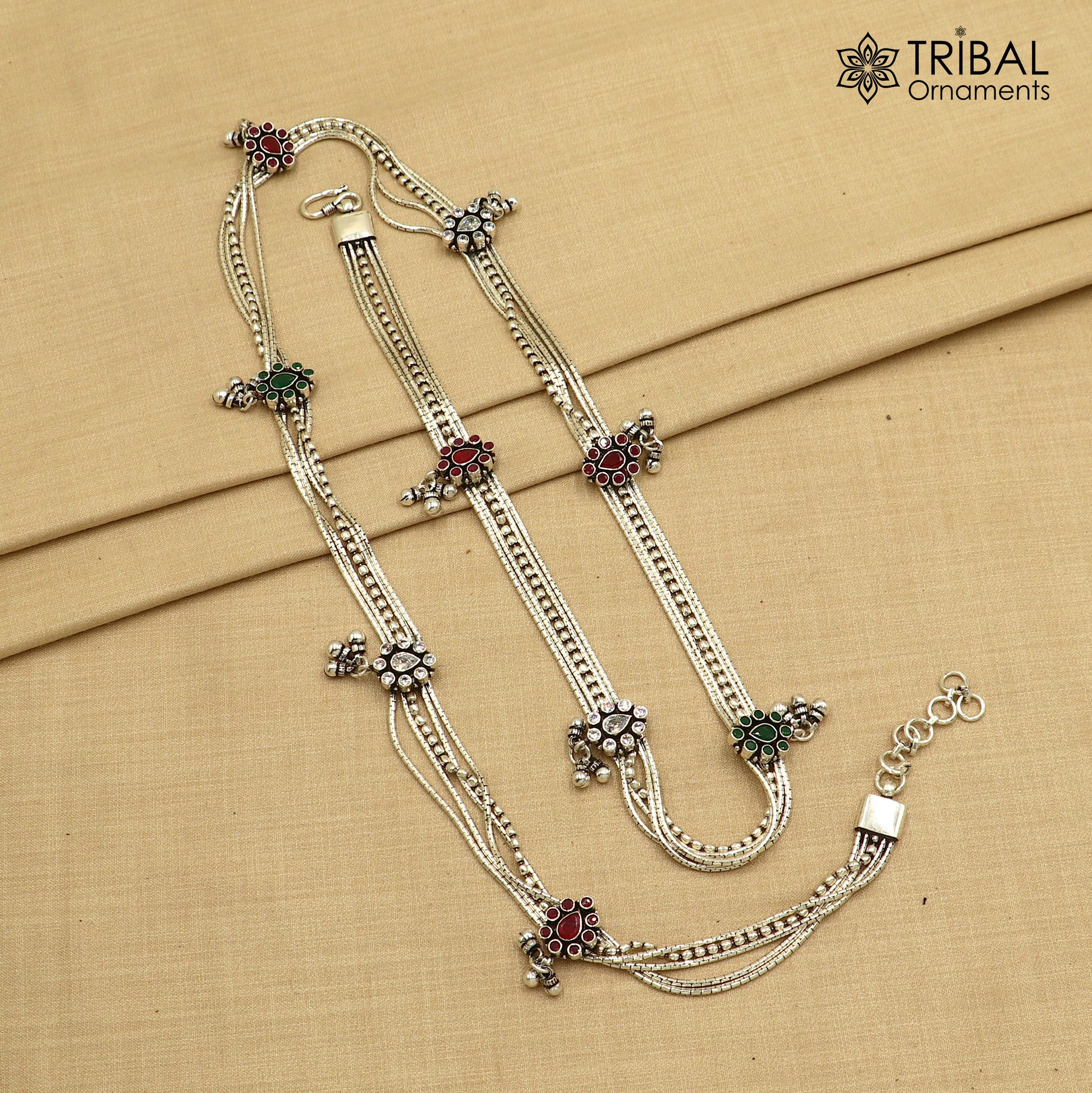 Sterling silver adjustable vintage-style belly chain with red stones, featuring a multi-line tribal design for waist or saree adornment.
