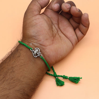 Sterling silver Lord Ganesha OM design pendant bracelet with red thread, tribal ornaments brand, traditional thread rakhi bracelet.