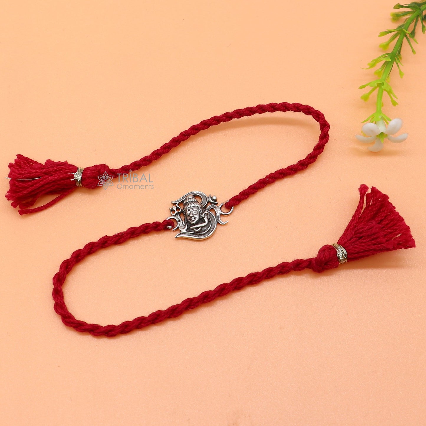 925 Sterling silver Lord Shiva thread rakhi bracelet with "Aum" OM design on red thread, crafted by TRIBAL ORNAMENTS.