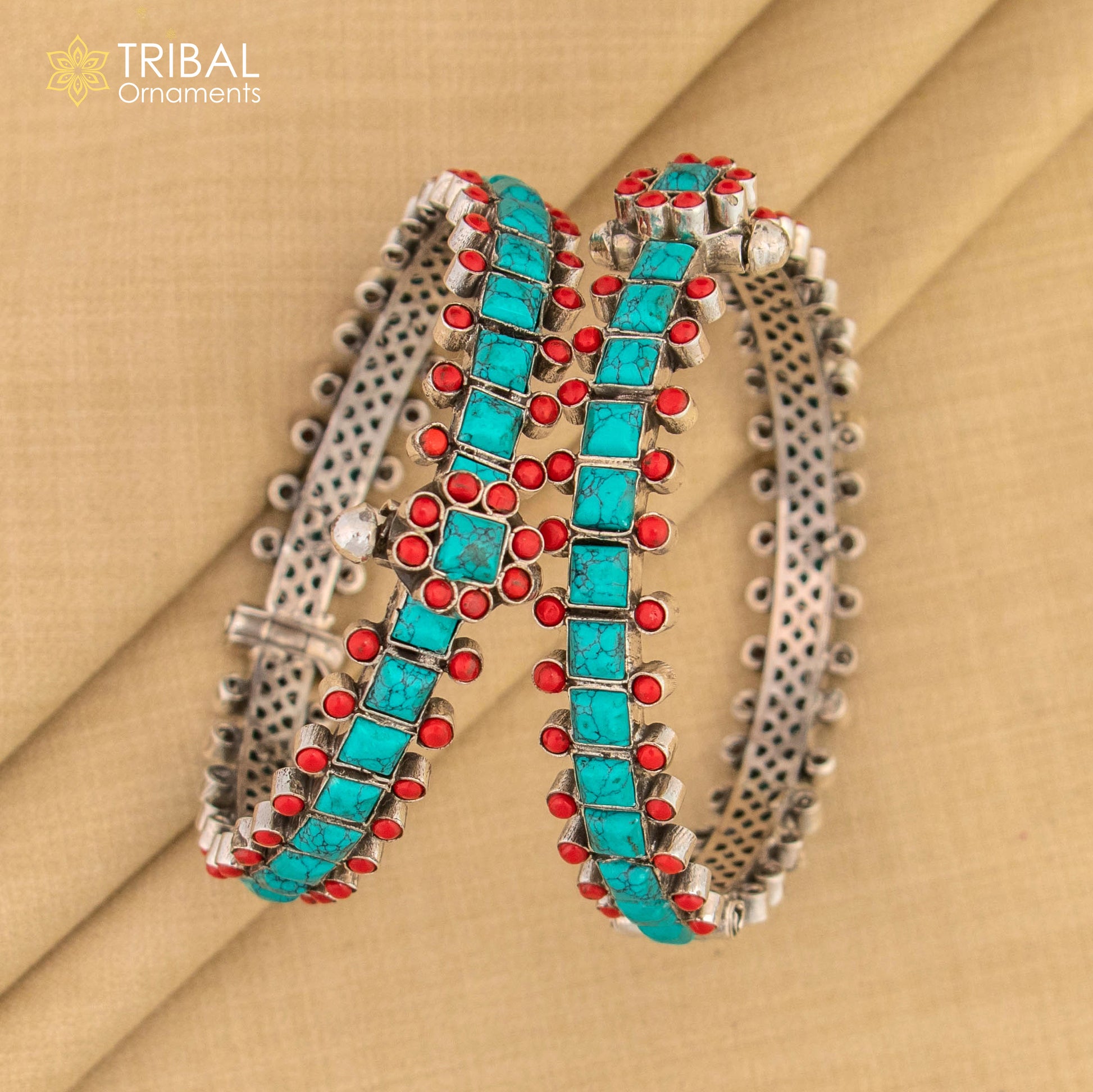 Sterling silver tribal bangle bracelet with turquoise stone and unique closure, featuring customized vintage tribal jewelry design.