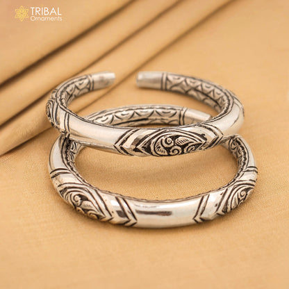 Sterling silver chitai work bangle bracelet by TRIBAL ORNAMENTS, unisex personalized jewelry with intricate design.