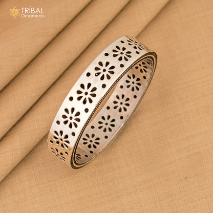 Sterling silver floral bangle bracelet by TRIBAL ORNAMENTS, vintage design jewelry for brides, featuring intricate floral details.