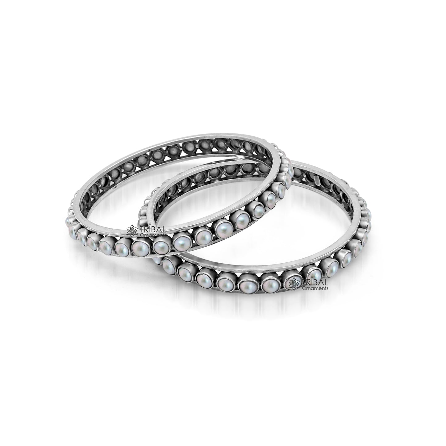 Sterling silver pearl bangle bracelet by Tribal Ornaments with oxidized finish, perfect for bridal or gifting occasions.