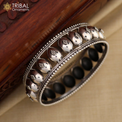 Vintage floral design 925 sterling silver bangle bracelet by TRIBAL ORNAMENTS, featuring intricate tribal ethnic craftsmanship.