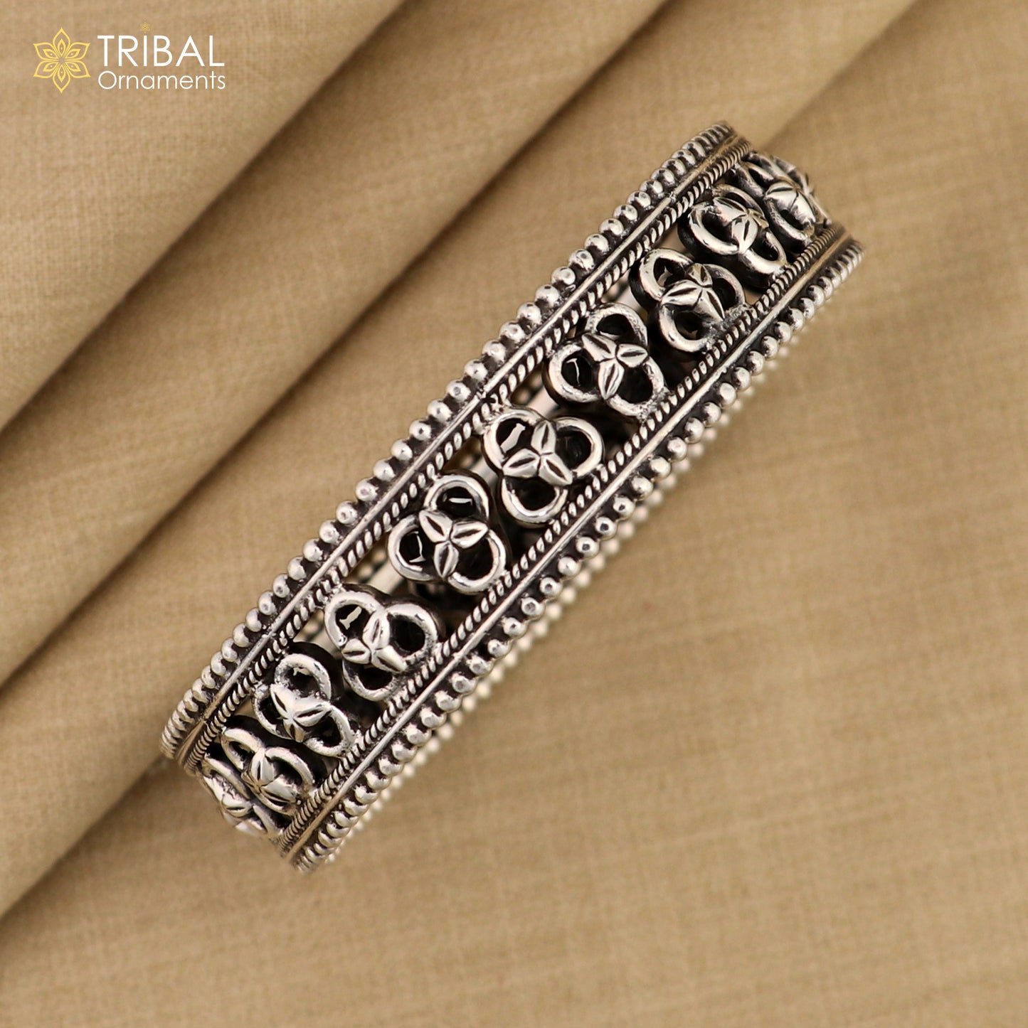 925 sterling silver tribal bangle bracelet with trendy cultural design from TRIBAL ORNAMENTS, featuring intricate tribal patterns.