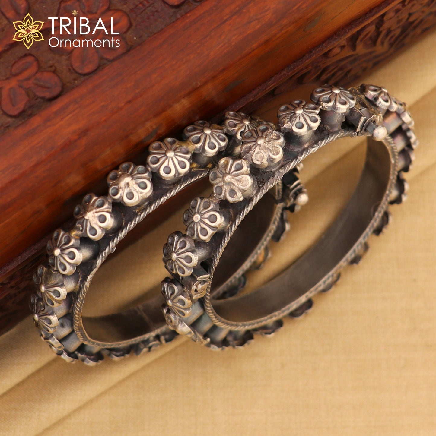 Sterling silver tribal floral bangle bracelet with intricate design, perfect for bridal wedding jewelry from TRIBAL ORNAMENTS.