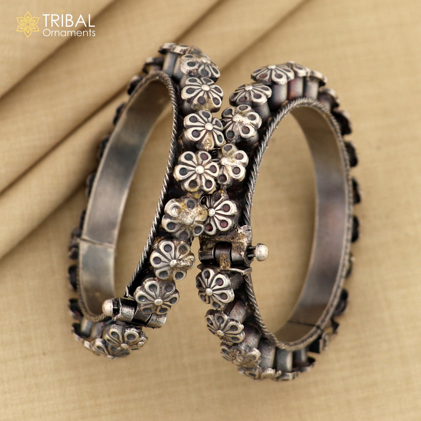 Sterling silver tribal floral bangle bracelet from TRIBAL ORNAMENTS, detailed design ideal for wedding or cultural jewelry.
