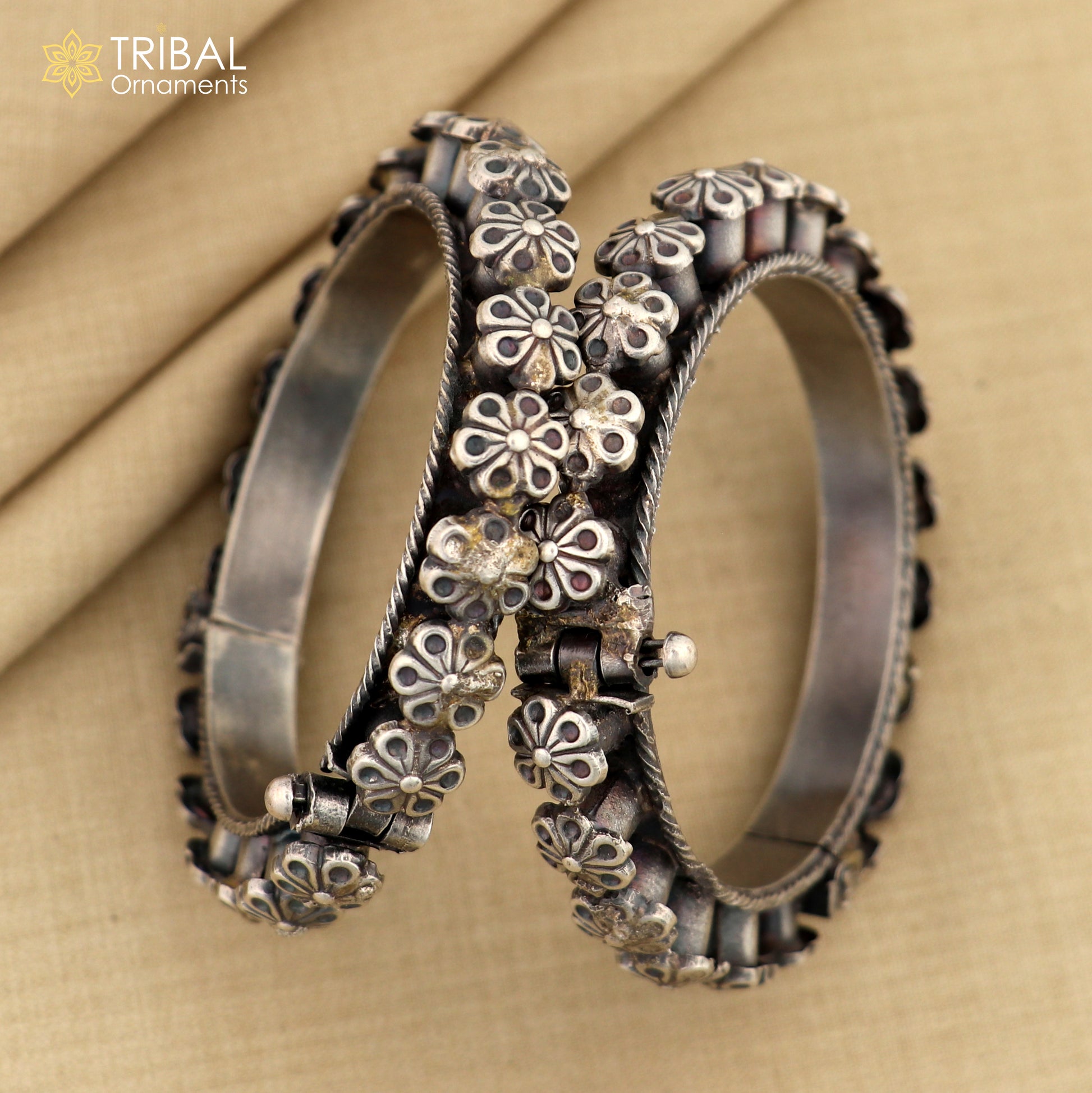 Sterling silver tribal floral bangle bracelet from TRIBAL ORNAMENTS, detailed design ideal for wedding or cultural jewelry.