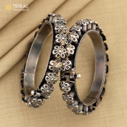 Sterling silver tribal floral bangle bracelet from TRIBAL ORNAMENTS, detailed design ideal for wedding or cultural jewelry.
