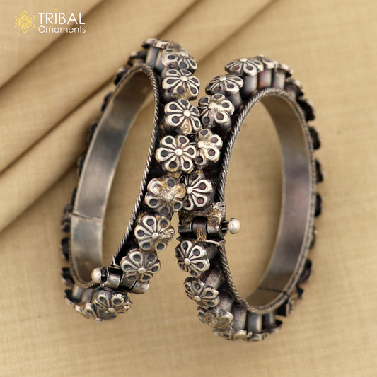 Sterling silver tribal floral bangle bracelet from TRIBAL ORNAMENTS, detailed design ideal for wedding or cultural jewelry.