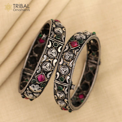 Sterling silver vintage pink stone bangle bracelet with tribal design, stylish jewelry piece featuring intricate craftsmanship.
