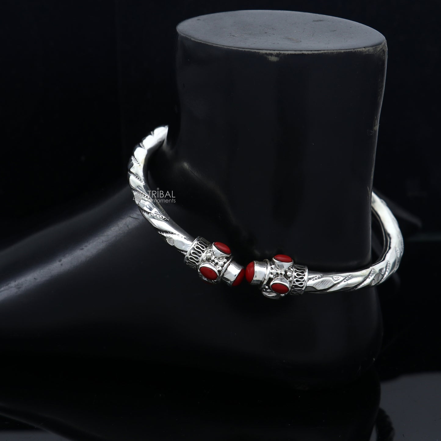 Sterling silver ankle kada bracelet with stylish design and vibrant coral stone by Tribal Ornaments, featuring intricate craftsmanship.