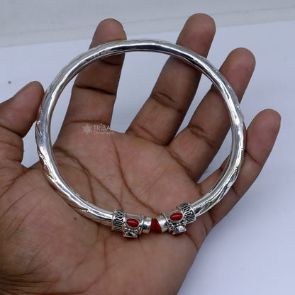 Sterling silver ankle kada bracelet with a stylish design and vibrant coral stone, crafted by TRIBAL ORNAMENTS.