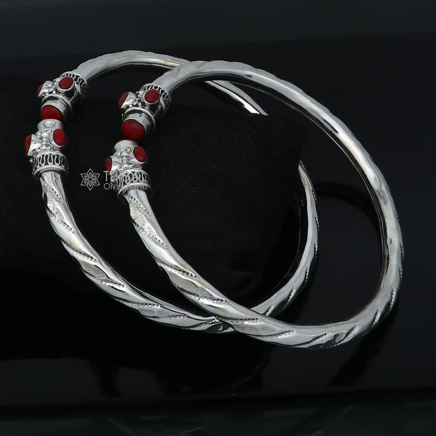 Sterling silver ankle kada bracelet with a stylish design and a vibrant coral stone, perfect for elegant traditional jewelry.