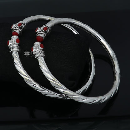 Sterling silver ankle kada bracelet with a stylish design and a vibrant coral stone, perfect for elegant traditional jewelry.