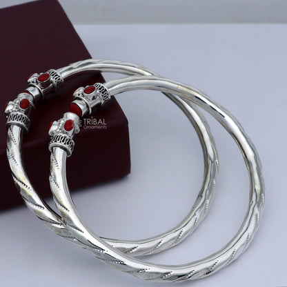 Sterling silver ankle kada bracelet with stylish design and vibrant coral stone, featuring a traditional tribal ornament style.