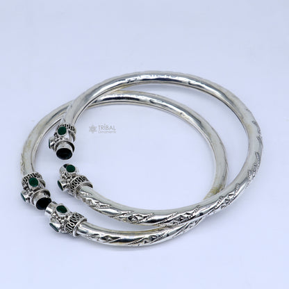 Sterling silver ankle bangle bracelet with stylish design and a vibrant green stone, perfect for elegant ankle jewelry.