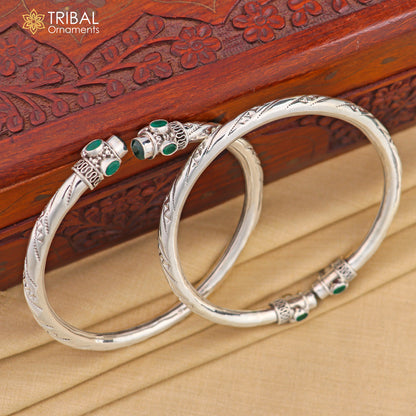 925 sterling silver ankle kada bracelet with stylish design and a vibrant green stone, featuring intricate tribal ornament details.