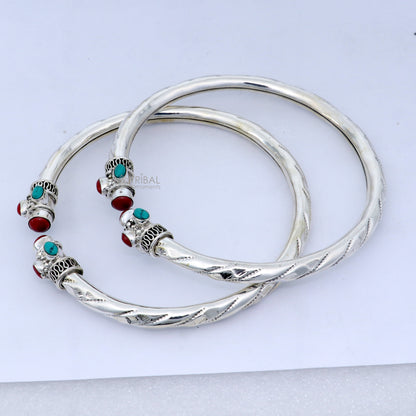 Sterling silver ankle kada bracelet with stylish design and multi-color stones, featuring a tribal-inspired bangle style.