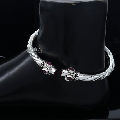 Sterling silver ankle kada bracelet with a stylish design and red stone detail, perfect for traditional or contemporary foot jewelry.