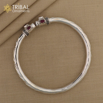 Sterling silver ankle kada bracelet with stylish design and red stone accents, ideal for foot jewelry and trendy accessories.