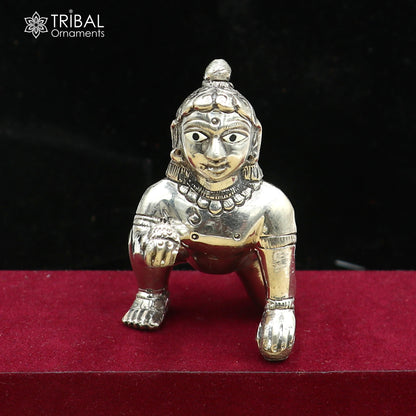 925 sterling silver idol of divine Krishna, Laddu Gopal crawling statue figurine by Tribal Ornaments on a decorative base.