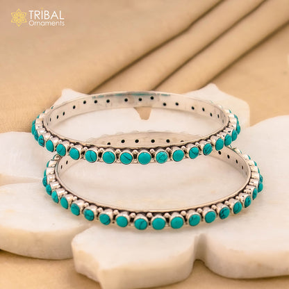 925 sterling silver turquoise stone bangle from Tribal Ornaments, showcasing intricate design and vibrant turquoise in a delicate jewelry piece.