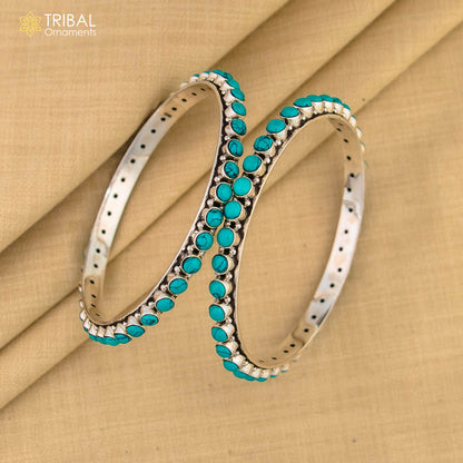 Sterling silver turquoise stone bangle from Tribal Ornaments, handcrafted pure silver jewelry with vibrant turquoise accents.
